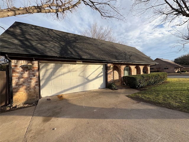 view of front of house with stone siding, roof with shingles, concrete driveway, an attached garage, and brick siding