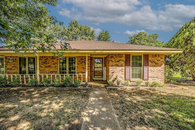 ranch-style home featuring a porch