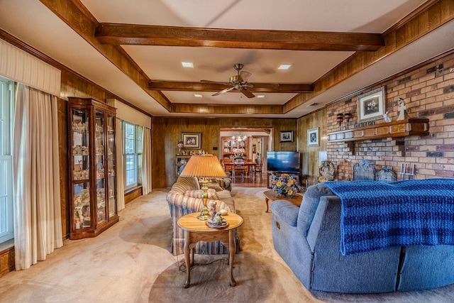 living room featuring ceiling fan, light colored carpet, beamed ceiling, and wooden walls