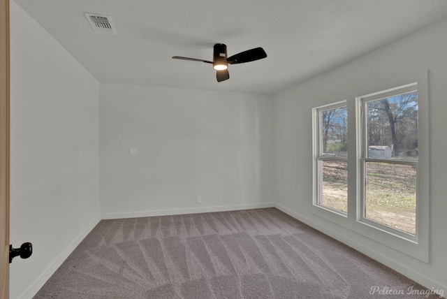 unfurnished room featuring carpet floors and ceiling fan