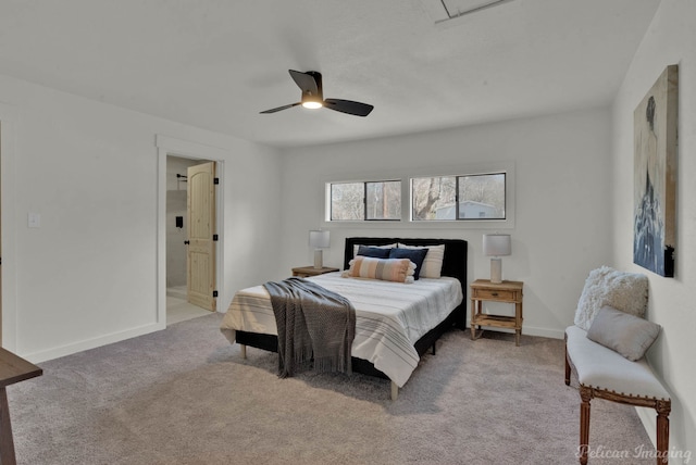 carpeted bedroom with ceiling fan and ensuite bathroom