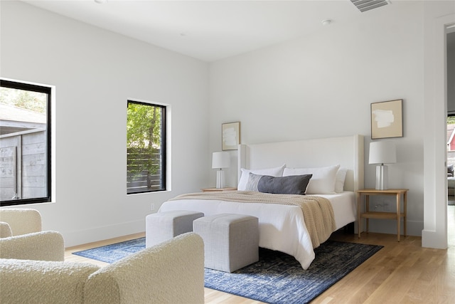 bedroom with light hardwood / wood-style flooring