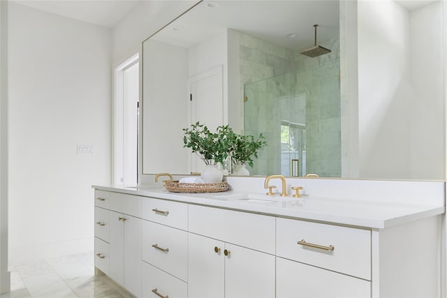 bathroom with a shower with door and vanity