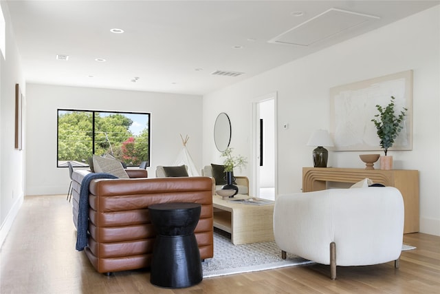 living room with light hardwood / wood-style floors