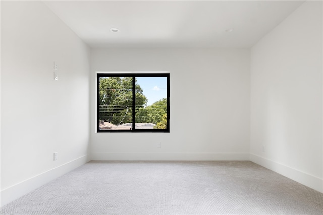 empty room with light colored carpet