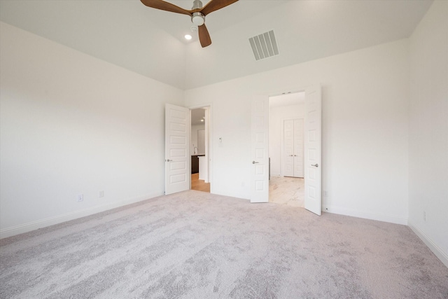 unfurnished bedroom featuring ceiling fan, light carpet, and high vaulted ceiling