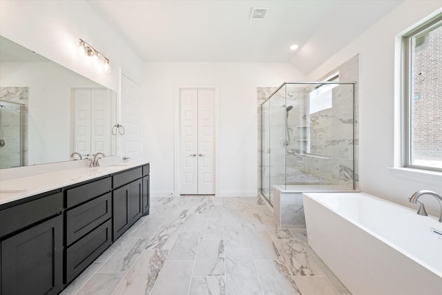 bathroom with separate shower and tub and vanity