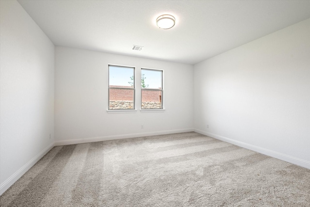 empty room featuring carpet floors