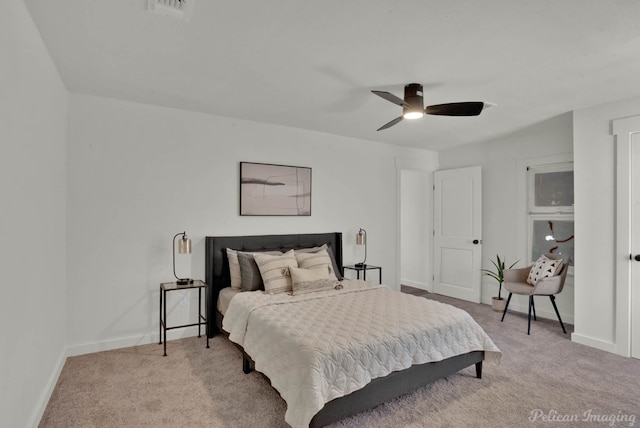 bedroom featuring ceiling fan and light colored carpet