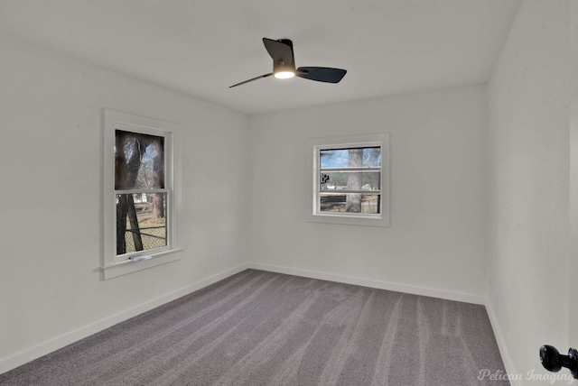 spare room featuring ceiling fan and carpet