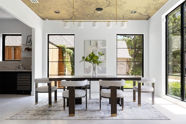 dining room featuring sink and wine cooler