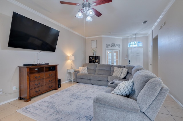 tiled living room featuring ceiling fan, ornamental molding, and french doors