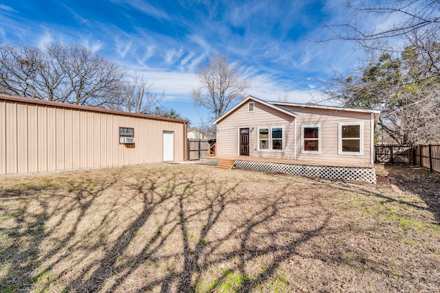 back of property featuring a lawn