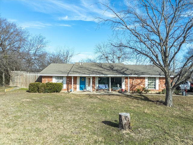 ranch-style home featuring a front yard