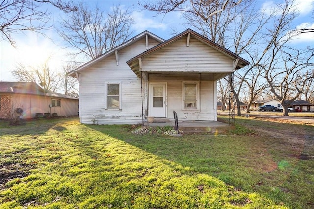 bungalow-style house featuring a front yard