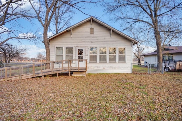 rear view of property with a deck