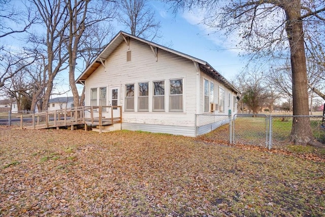 back of house with a wooden deck