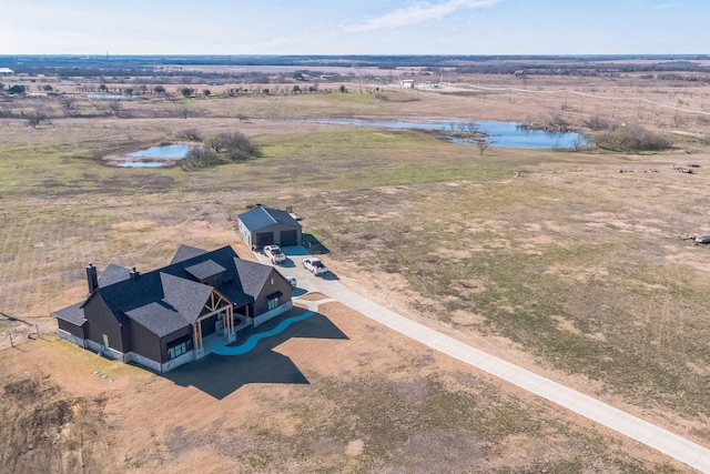 aerial view featuring a rural view and a water view