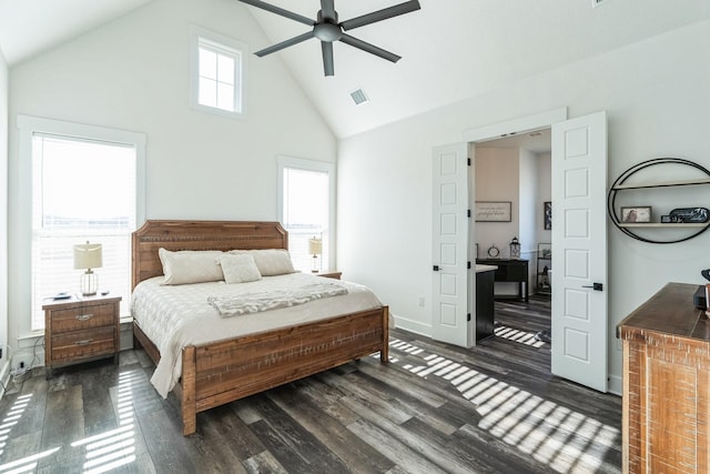 bedroom featuring ceiling fan, multiple windows, dark hardwood / wood-style floors, and high vaulted ceiling