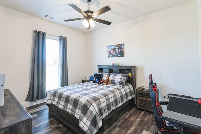 bedroom featuring dark wood-type flooring and ceiling fan