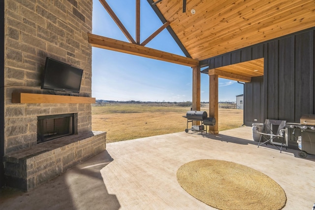 view of patio featuring an outdoor stone fireplace