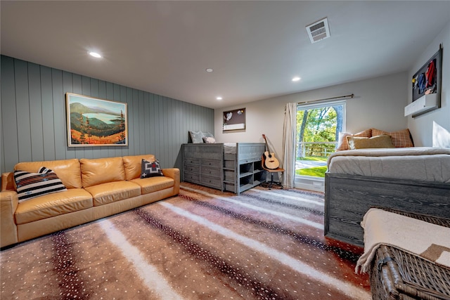 living room with wooden walls