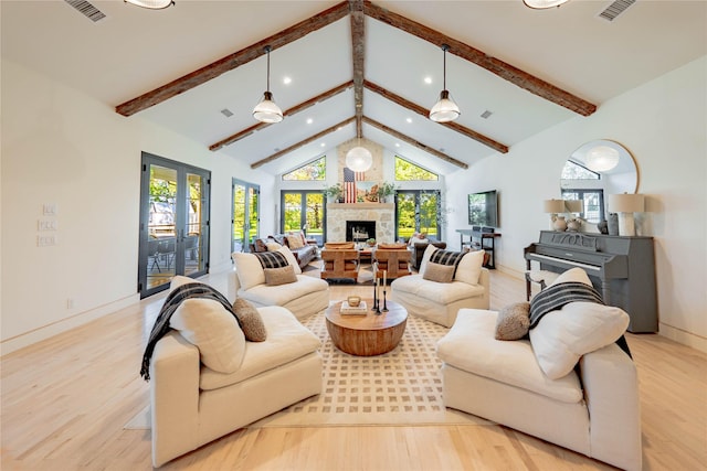 living room featuring high vaulted ceiling, light hardwood / wood-style floors, french doors, and beamed ceiling