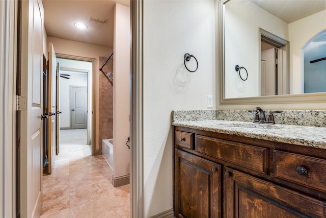 bathroom featuring shower / bathtub combination and vanity