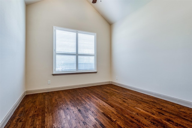 spare room with vaulted ceiling, ceiling fan, and dark hardwood / wood-style flooring