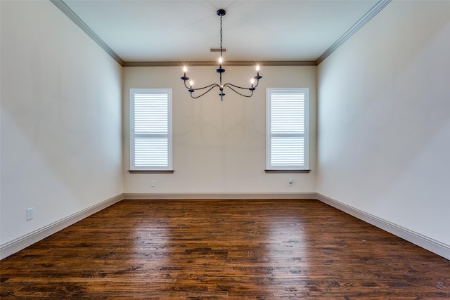 empty room with a chandelier, crown molding, and dark hardwood / wood-style floors