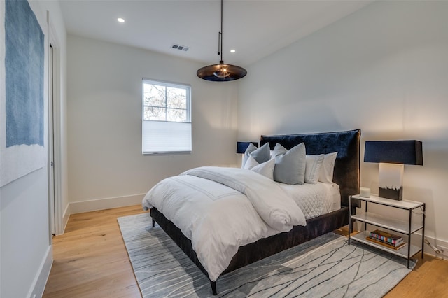 bedroom with light hardwood / wood-style floors