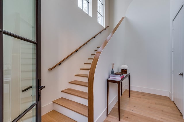 stairway featuring hardwood / wood-style floors