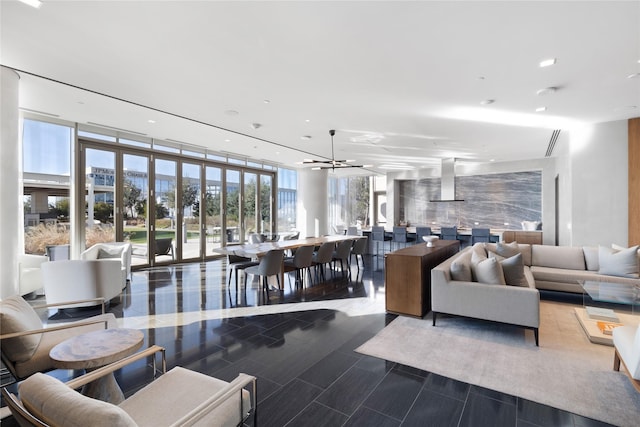 living room featuring expansive windows and a chandelier