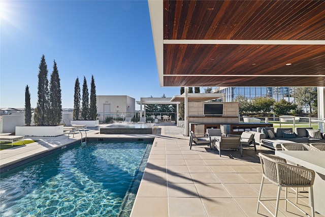 view of swimming pool featuring a bar and a patio