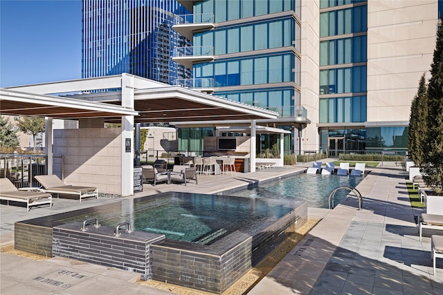 view of pool featuring a patio