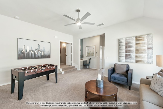 carpeted living room with ceiling fan and lofted ceiling