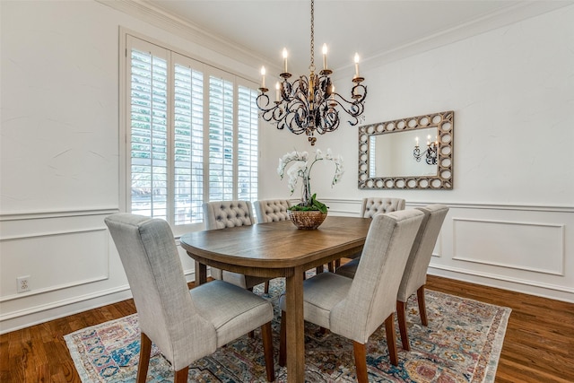 dining space featuring dark hardwood / wood-style floors and ornamental molding