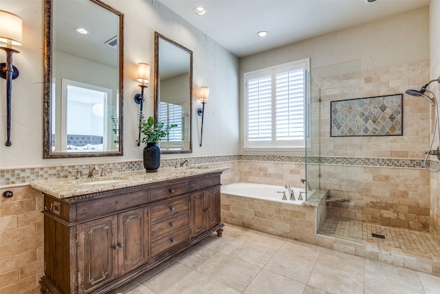 bathroom with tile patterned floors, vanity, and independent shower and bath