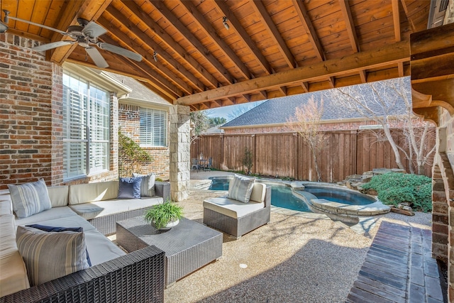 view of patio featuring an outdoor living space, a swimming pool with hot tub, and ceiling fan