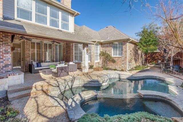 view of swimming pool with an in ground hot tub, a patio, outdoor lounge area, and ceiling fan