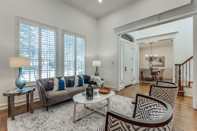 living room featuring ceiling fan, ornamental molding, and dark wood-type flooring