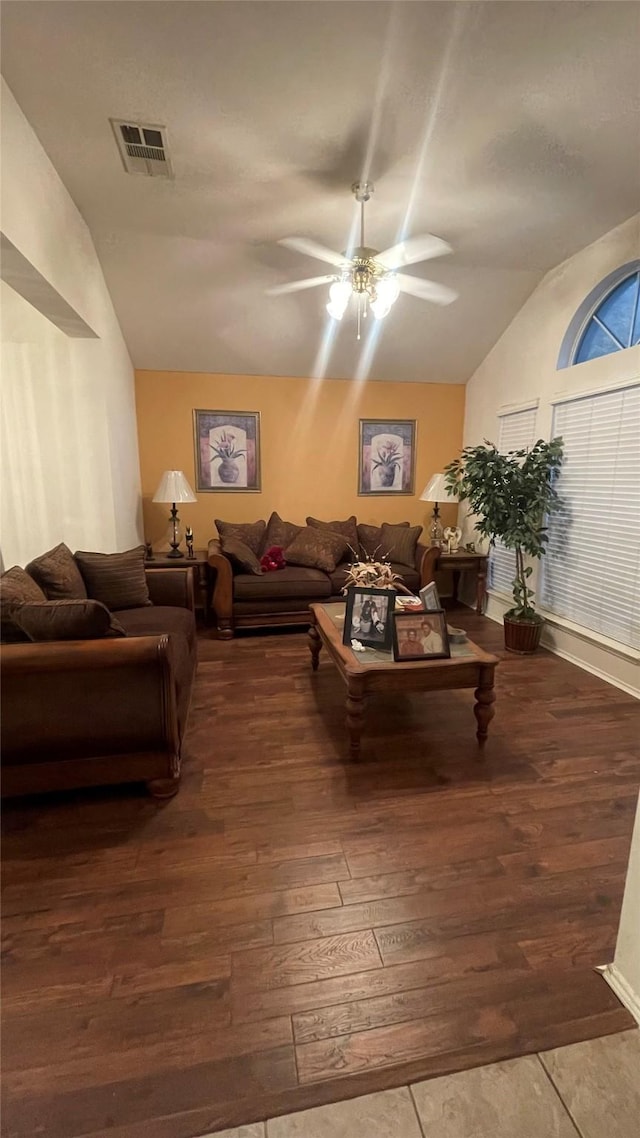 living room with vaulted ceiling, ceiling fan, and hardwood / wood-style flooring