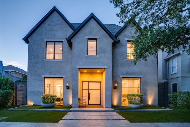 view of front of property with a yard