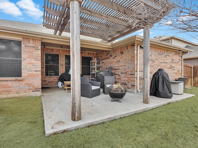 view of patio / terrace with an outdoor fire pit and a pergola