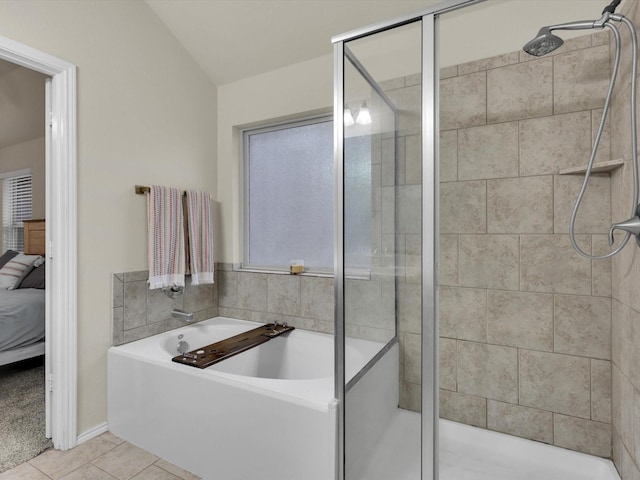 bathroom with independent shower and bath and tile patterned floors