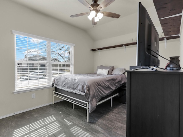 bedroom with ceiling fan, lofted ceiling, wood-type flooring, and multiple windows