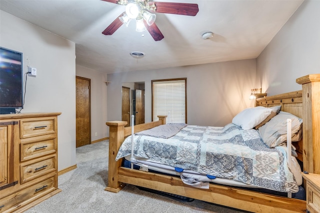 bedroom with ceiling fan and light colored carpet