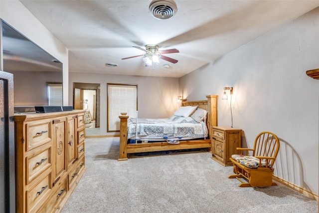 bedroom with light carpet and ceiling fan