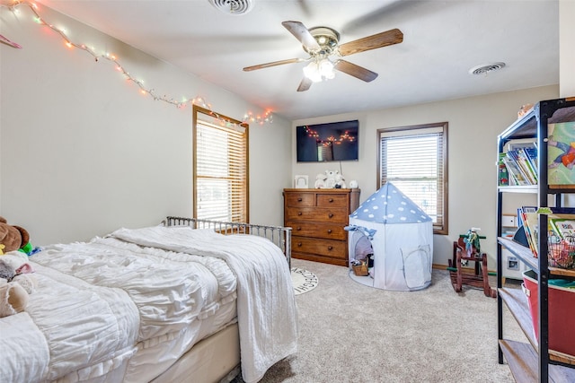 carpeted bedroom featuring ceiling fan