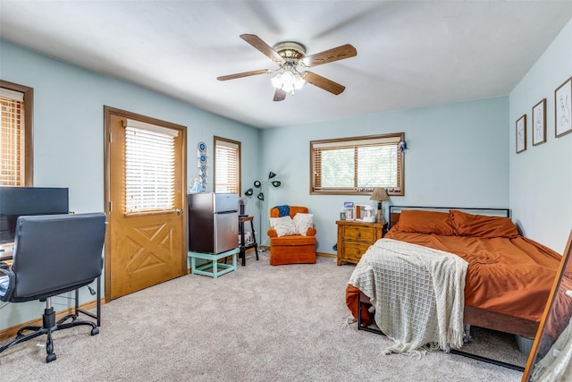 carpeted bedroom featuring ceiling fan